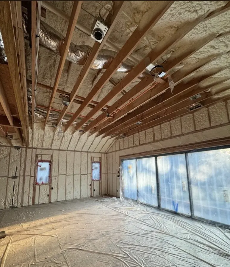 Interior walls and ceiling insulated with spray foam during new construction in Kalkaska